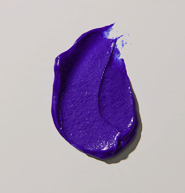 Sample swipe of deeply pigmented purple Unite Blonda Fix Violet Toning Treatment