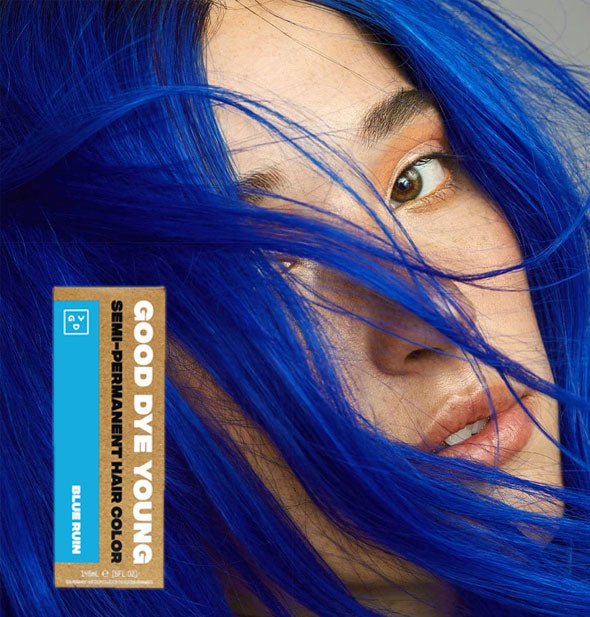 Model with bright blue hair color by Good Dye Young in the shade Blue Ruin