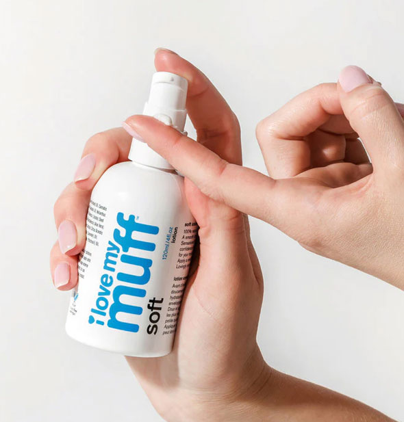 Model applies a dollop of I Love My Muff Soft lotion onto fingertip