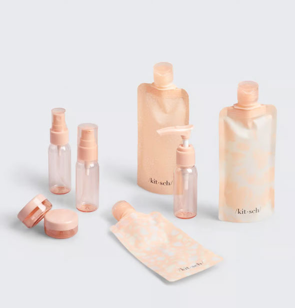 Contents of the Blush Ultimate Travel Set by Kitsch includes three bottle pouches, two mini spray bottles, one mini pump bottle, and two jars
