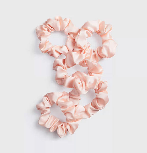 Five pink satin hair scrunchies