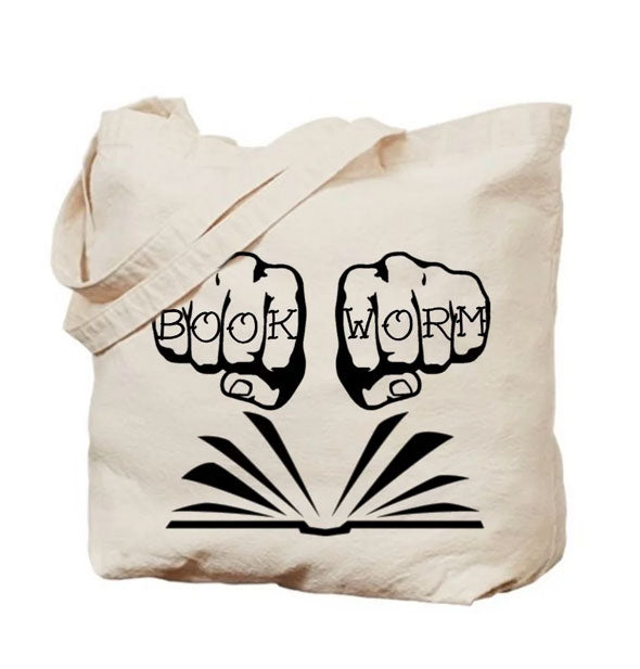 White canvas tote bag with open book illustration and hands with knuckles tattooed to say, "Book Worm"