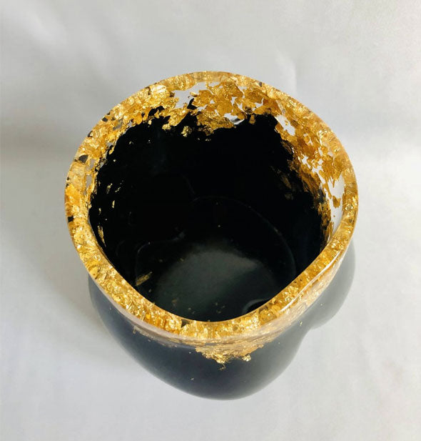 Top view of black and gold butt-shaped planter
