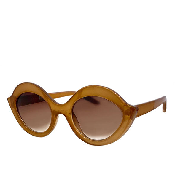 Pair of brown sunglasses with eye-shaped frames