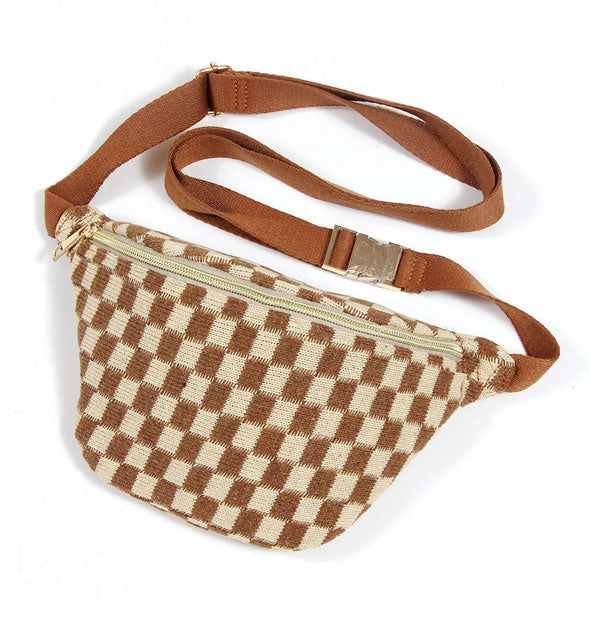 Brown and cream checkered sling bag with brown strap and gold buckle and zipper hardware
