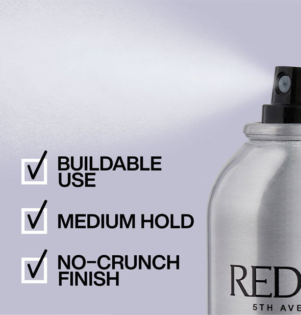 A fine mist of product is dispensed from a can of Redken hairspray with key benefits listed: Brushable use, medium hold, no-crunch finish