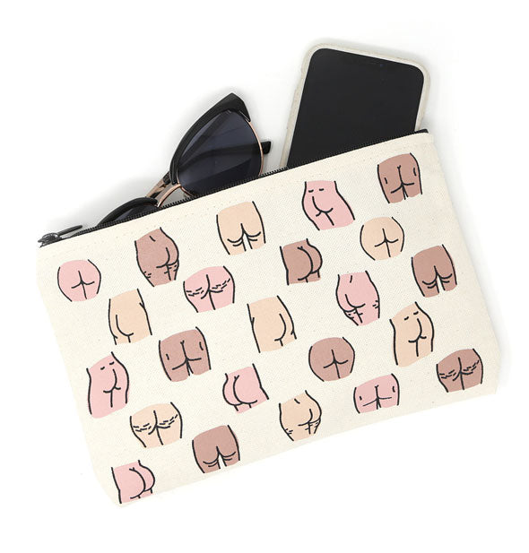Canvas pouch with all-over buttocks illustrations shown with a phone and pair of sunglasses partially inside
