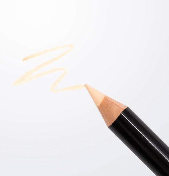 Black pencil with light-colored tip draws a sample squiggle