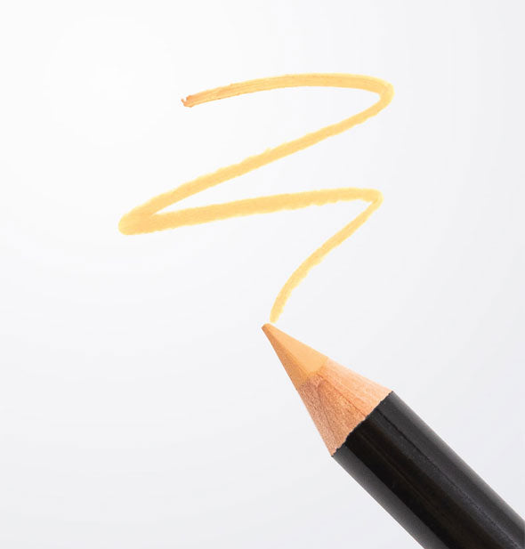 Black pencil with tan-colored tip draws a sample squiggle