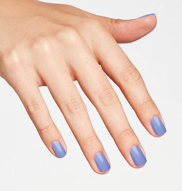 Model's hand wearing a light blue shade of nail polish