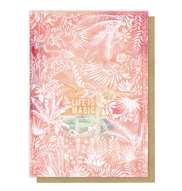 Life Is Magic greeting card with white floral designs overtop a sunset-colored background