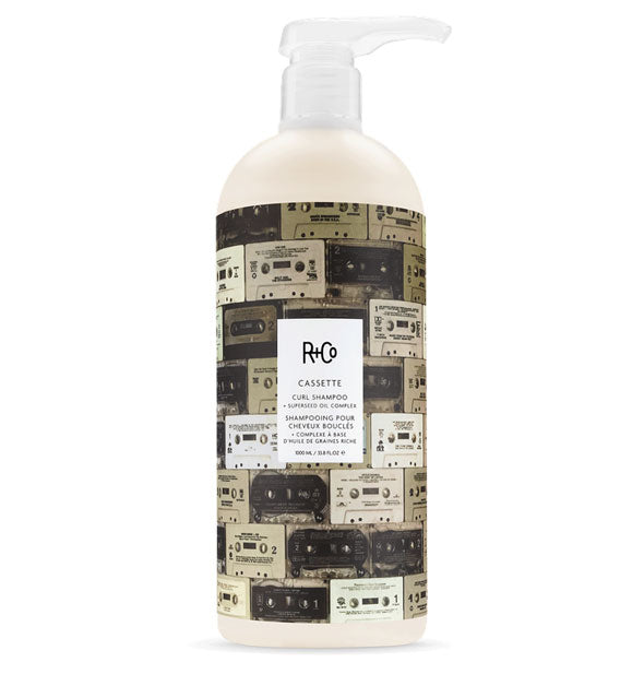 33.8 ounce bottle of R+Co Cassette Curl Defining Shampoo + Superseed Oil Complex