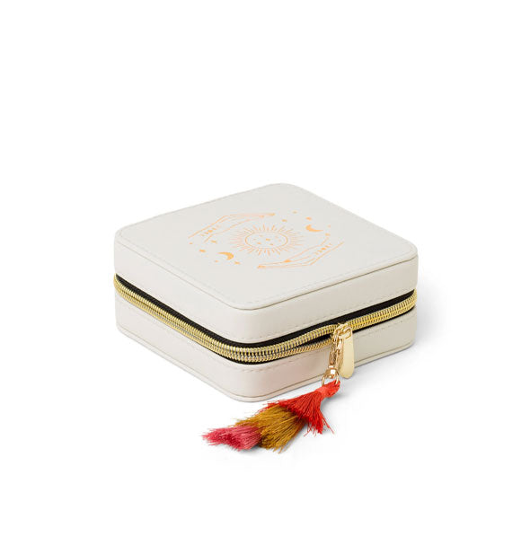 Angled view of white jewelry case with gold zipper and colorful tassel zipper pull