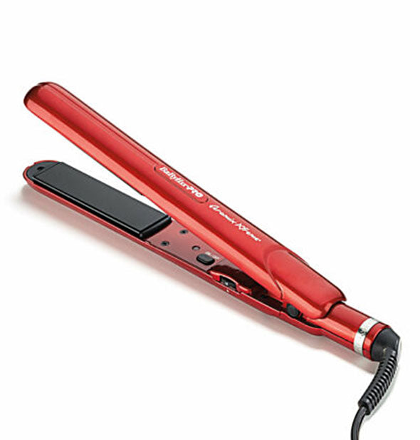 Open red BaBylissPRO flat iron with black plates and cord