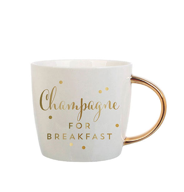 White coffee mug with gold handle says, "Champagne for Breakfast" in metallic gold lettering with polkadot accents
