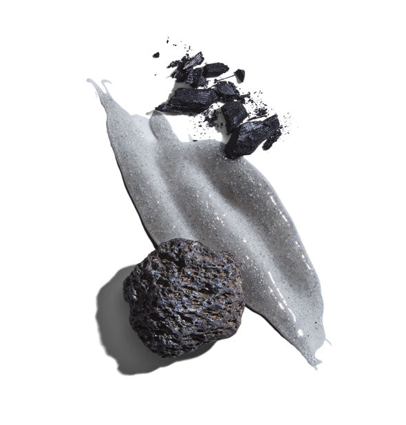 Jack Black Charcoal Body Buff Exfoliating Cleanser application with volcanic stone pieces