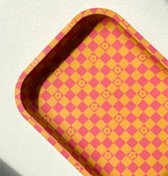 Pink and yellow checkered floral tray closeup