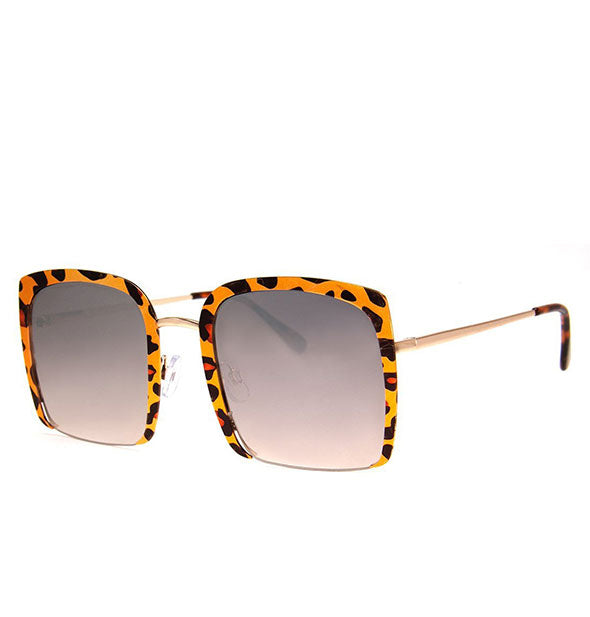 Pair of sunglasses with three-quarter leopard print frame and light gradient tint
