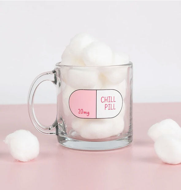 Clear glass Chill Pill mug filled and staged with cotton balls