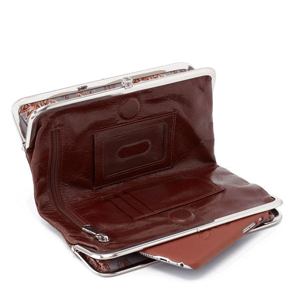 Open dark brown leather wallet with silver hardware