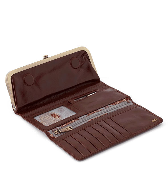 Open dark brown leather wallet with brass hardware
