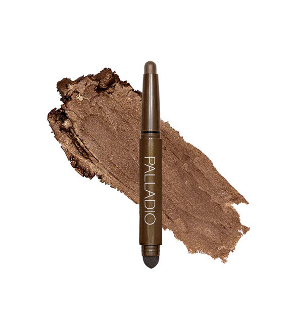 Double-ended Palladio eyeshadow stick with color at one end and black blending sponge at the other rests in front of a color swatch sample in the shade Chocolate Shimmer