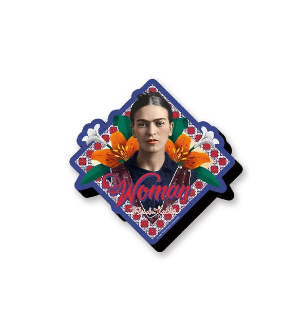 Diamond-shaped three-dimensional magnet with portrait of Frida Kahlo surrounded by flowers and tile pattern says, "Woman" in red lettering