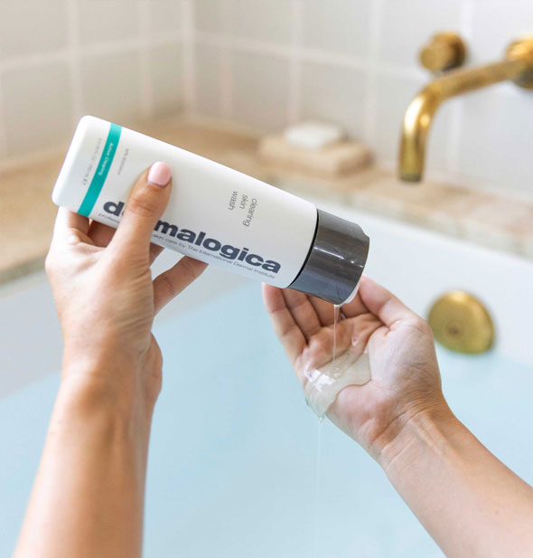 Model pours Dermalogica Clearing Skin Wash from bottle into opposite hand