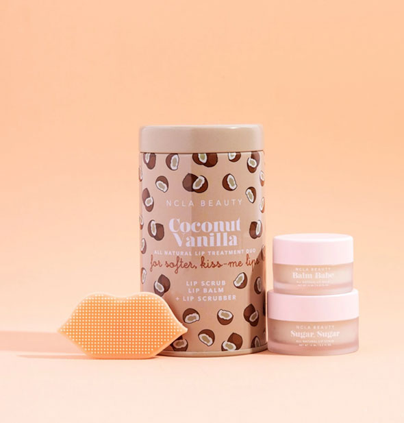 NCLA Beauty Coconut Vanilla lip treatment set includes tin, two pots, and a textured lip-shaped scrubber