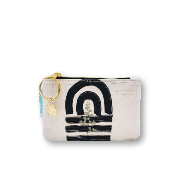 Rectangular white pouch with bold black brushstroke lines and pressed flower accent features a gold lotus charm hanging off of a gold zipper pull