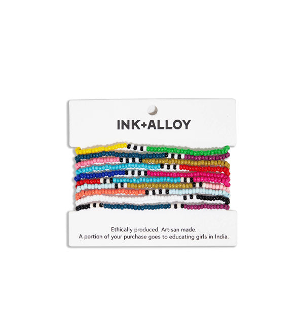 Set of 10 beaded bracelets on Ink + Alloy product card feature color-blocked designs with intermittent black and white striped sections