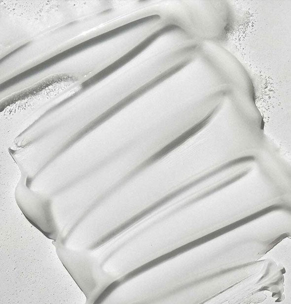 Closeup of Pureology Color Fanatic Multi-Tasking Leave-In Spray shows product consistency