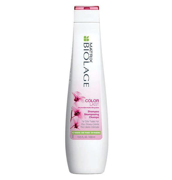 White 13.5-ounce bottle of Matrix Biolage ColorLast Shampoo with pink and green design accents.