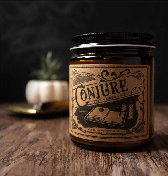 Conjure candle jar on wooden tabletop in moody light