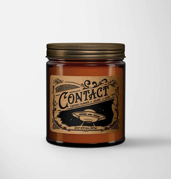 Contact candle in amber glass jar with metal lid features a kraft paper label in a vintage style with spaceship illustration