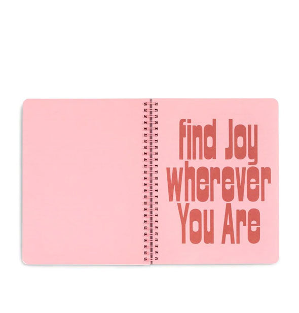 Notebook interior with large red lettering that says, "Find joy wherever you are"