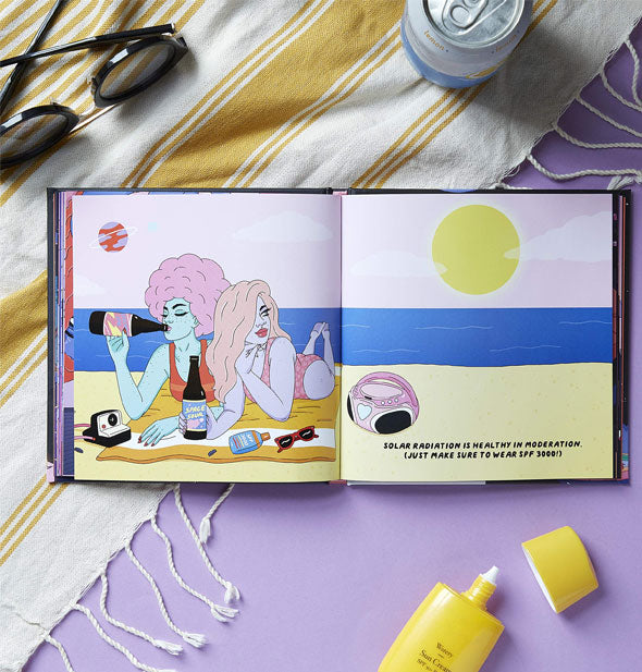 On a purple surface with yellow and white striped cloth, sunscreen, soda can, and sunglasses, Cosmic Care is open to an illustrated page spread with two friends on a beach captioned, "Solar radiation is healthy in moderation. (Just make sure to wear SPF 3000!)