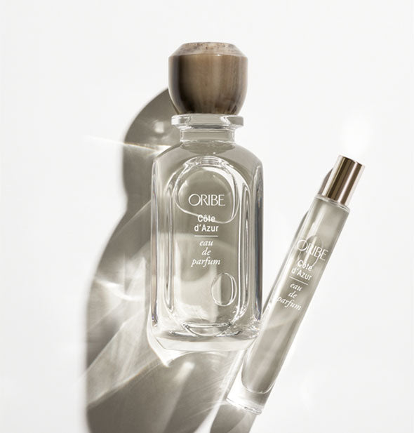 Clear glass bottle and slender travel vial of Oribe Côte d'Azur Eau de Parfum