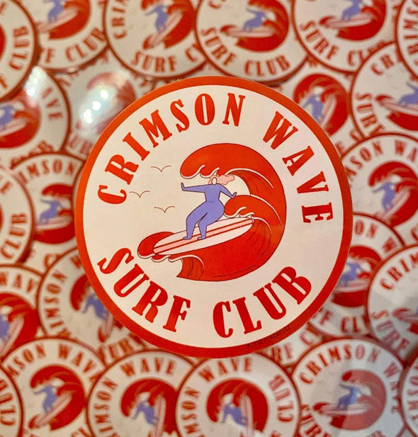 Crimson Wave Surf Club sticker in front of a background of others like it