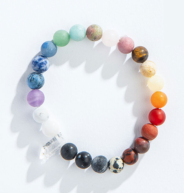 Colorful chakra stone bead bracelet with central clear crystal point \
