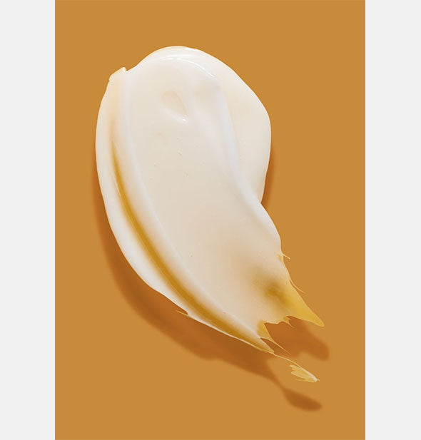 Sample daub of Verb Curl Cream on orange surface