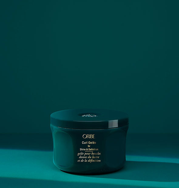 Teal pot of Oribe Curl Gelée for Shine & Definition on matching background