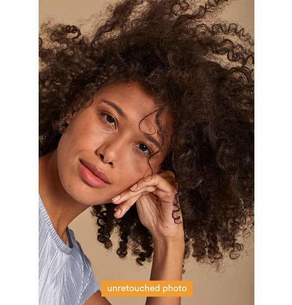Unretouched photo of a model demonstrating results of using Verb Curl Leave-In Conditioner