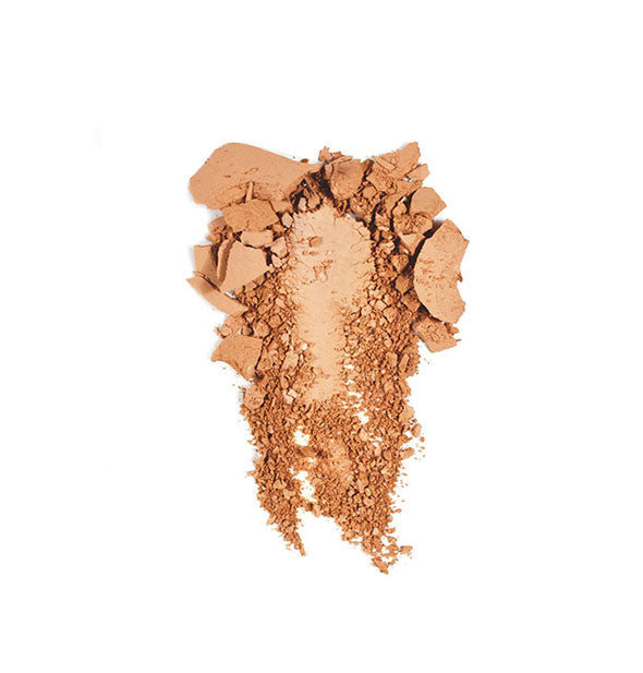 Crushed makeup powder in a light bronze shade