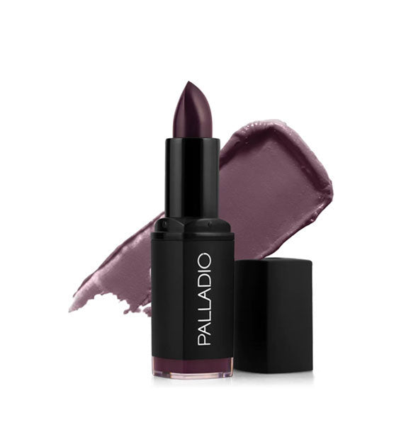 Black tube of Palladio lipstick with cap removed and color swatch behind in an aubergine-like shade called Darling Damask
