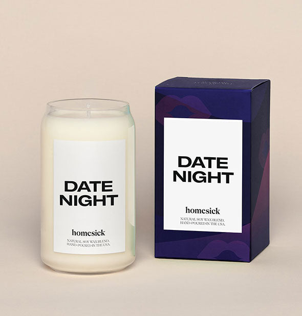Date Night candle by Homesick with white wax in glass jar next to dark blue box packaging