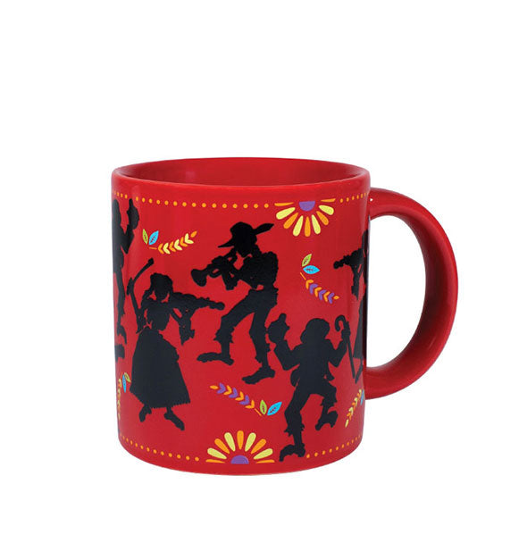 Red coffee mug with black figure outlines and colorful design elements
