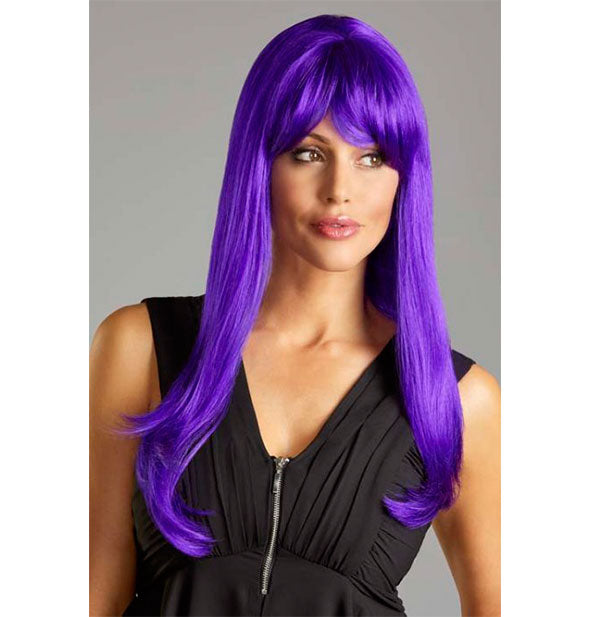 Model wearing a long, purple wig with bangs.