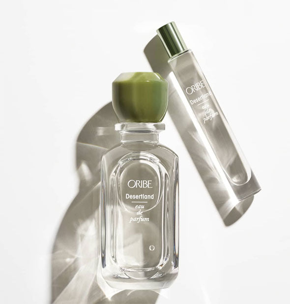 Clear glass bottle and slender travel vial of Oribe Desertland Eau de Parfum