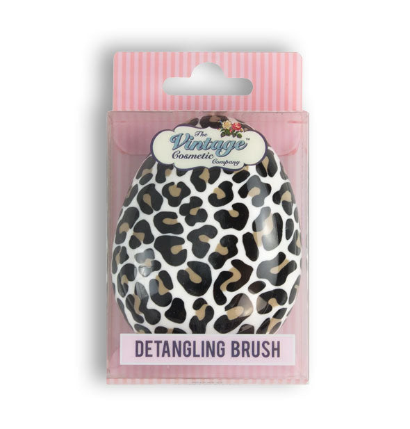 Leopard print egg-shaped detangling hairbrush by The Vintage Cosmetic Company in pink striped packaging